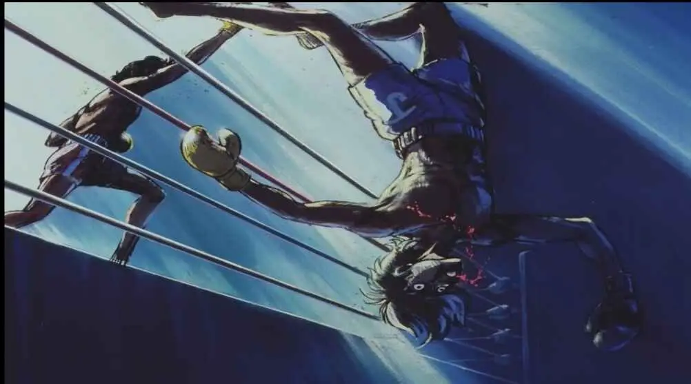 A boxer in the boxing ring taking a powerful hit, shown from a dynamic low angle